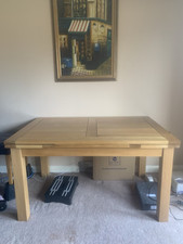 solid oak dining table and 4 chairs