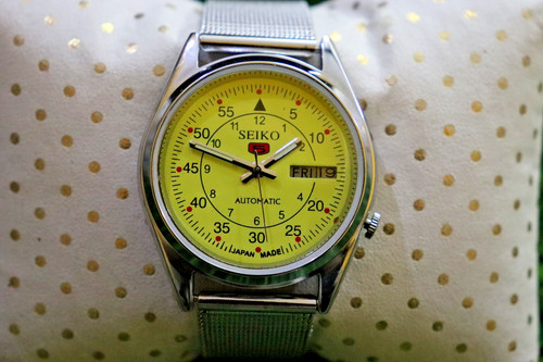 Watch along with yellow dial - along,