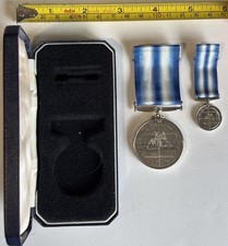 Commemorative  Arctic Campaign Medal with ribbon. Numbered. Cased. + Miniature