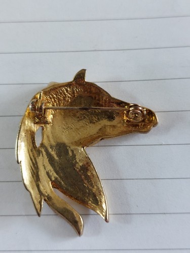 Gold coloured base metal horse - coloured,