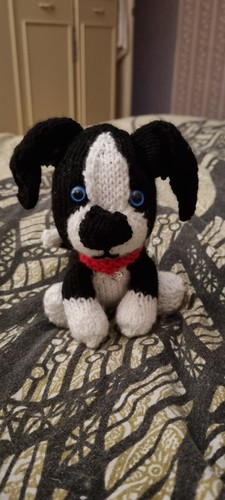 Collie puppy dog hand - hand, knitted