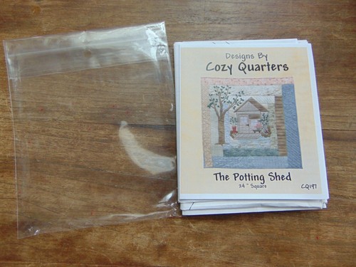 Log cabin potting shed - log, quilt