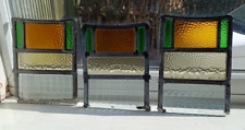 Three small 1930s stained glass window panels