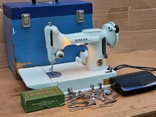 221K White Singer Featherweight Sewing Machine with accessories.