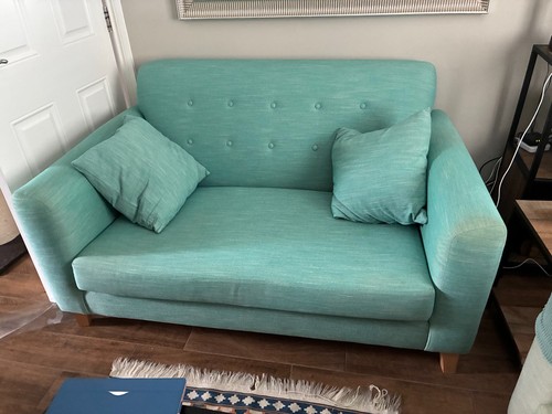Teal three seater sofa