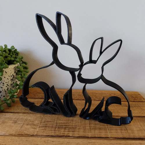 Line art rabbit pair sculpture - line,