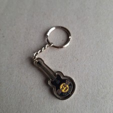 Hard rock café key ring, (Las Vegas) black guitar that spins.