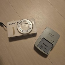Canon PowerShot SX600 HS Compact Digital Camera White with Charger Strap