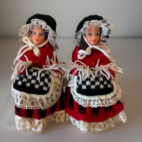 Two dolls wearing traditional - two,