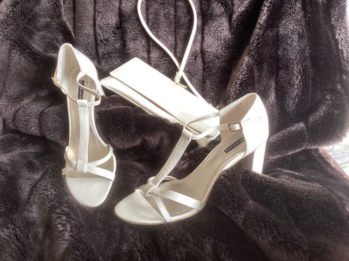 Pair ivory heeled - a, of