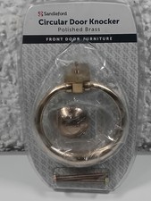 circular brass door knocker