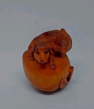 Vintage Japanese Boxwood Netsuke   Dog lying on the peach 