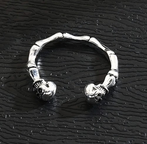 Silver tone open skull and - open,