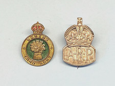 A WOMENS LAND ARMY BADGE + A. R. P.
