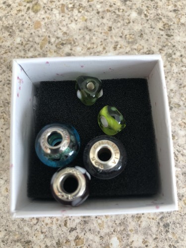 Five beads including - including, one