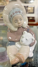 Lladro Eskimo Boy Sat With