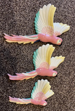 flying pink parrots -