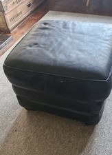 Black leather pouffe footstool
