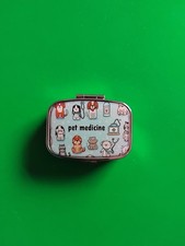 METAL PILL BOX FEATURING