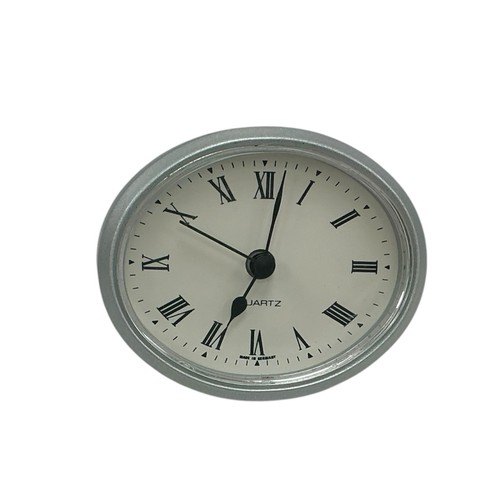 Silver oval quartz clock - *silver,