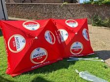 Pair of Amstel Parasol Umbrellas.