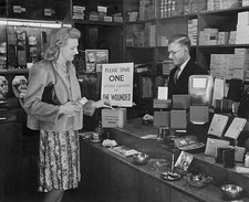 Woman buying a packet of