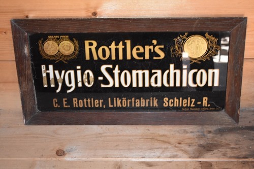 Old glass sign framed around