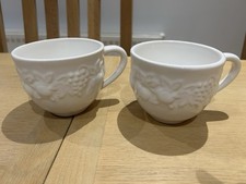 Two White Embossed Fruit Design Mugs