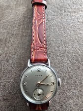CYMA VINTAGE WATCH SHOCK ABSORBER IN EXCELLENT CONDITION  COLLECTABLE NEW STRAP.