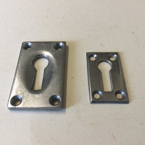 Pair escutcheon key holes - of,