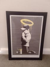 Banksy “Forgive Us Our