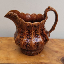c1820 Don Pottery Treacle Glaze Rose and Thistle Moulded Jug Yorkshire
