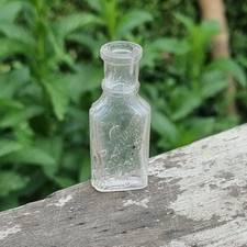 Antique Clear Glass Medicine Bottle with Embossed Script – Vintage Apothecary