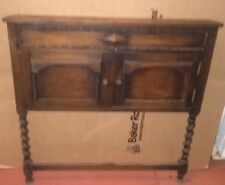 Vintage wooden carved front of unit with small door