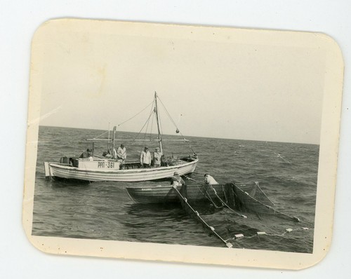 Small fishing boats hauling