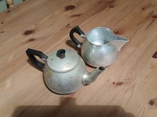 Exhibition Souvenir Teapot And Milk/Cream Jug. Aluminium. By Tower & Swan