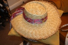 LADY'S LARGE BEACH HAT  FROM PRIMARK IN A  CREAM COLOUR WITH A RED FLORAL BAND