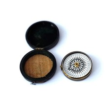 Small brass compass and case.