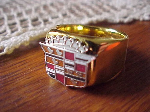 1950s cadillac crest gold - cadillac,