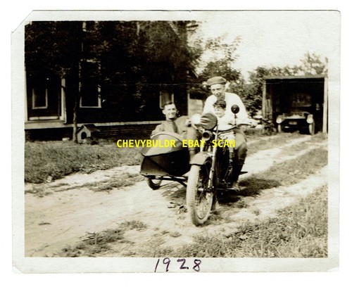 1928 men playing motorcycle - on,