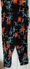 Really classy Roman Originals ladies black floral  jump Suit Size 18