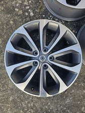  18-inch alloy wheel for a Nissan Qashqai, Silver and Grey Finish.