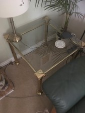 Single tier coffee table with glass top.