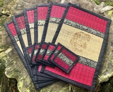 Large reed table place mat and coaster set with elephant design. 