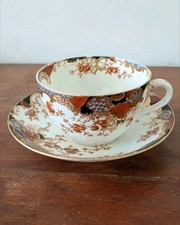 Imari Aynsley. Tea Cup & Saucer.  Flower motif in colors orange, rust navy blue.