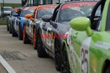 PHOTO  A LINE-UP OF MAZDA MX-5S WAITING FOR THEIR RACE IN THE ASSEMBLY AREA. BRS
