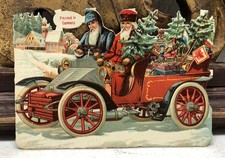 Pair of Santas in Vehicle w/