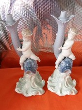 Pair Lladro Nao cherubs Sitting On A Fish Lamp Bases