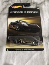 HOT WHEELS 2014 PORSCHE SERIES PORSCHE 918 SPYDER, BLACK/GOLD, LONG CARD.
