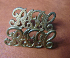 PAIR of Royal Army Pay Corps RAPC brass shoulder titles.